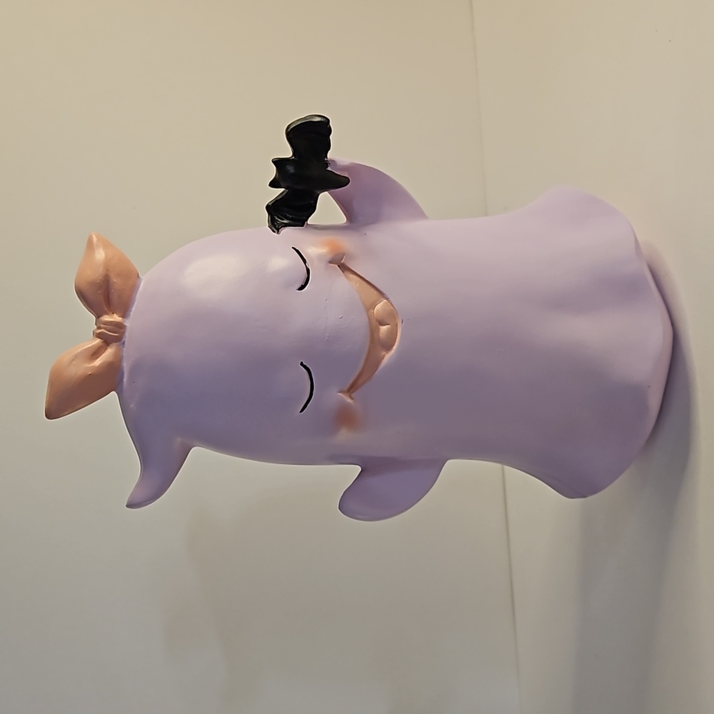 Pink ghost girl with bat in hand